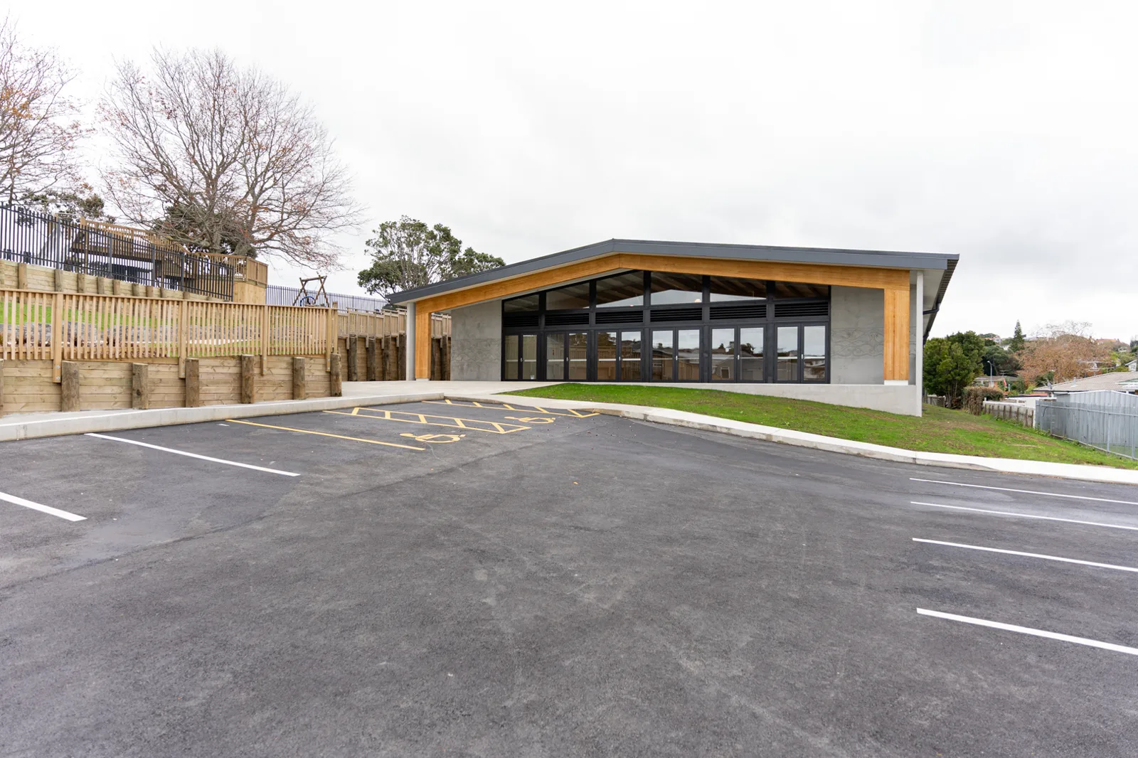 Wide view of the hydrotherapy pool hall with curved glulam frames sweeping overhead